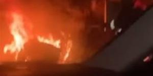 احتراق سيارة أعلي طريق الأوتوستراد أمام مساكن الضباط وإصابة السائق بحروق